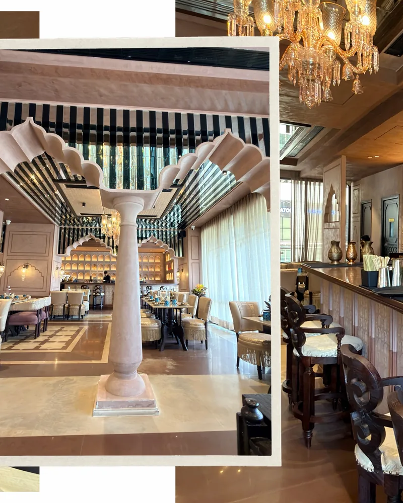 Interior of Bagaan, a fine dining restaurant in Gurugram — scalloped Mughal arches, a marble pillar and crystal chandeliers.